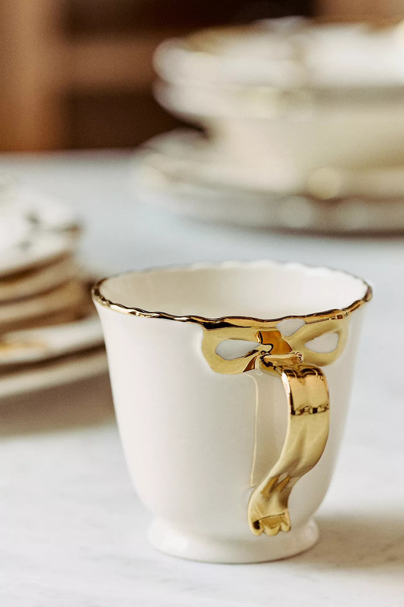 Benedita Bow Stoneware Gold Mug